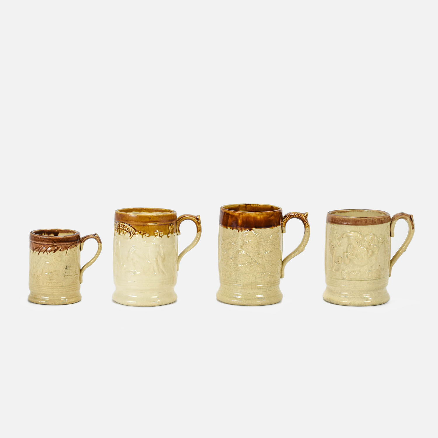 Four Antique English Stoneware Embossed Beer Mugs